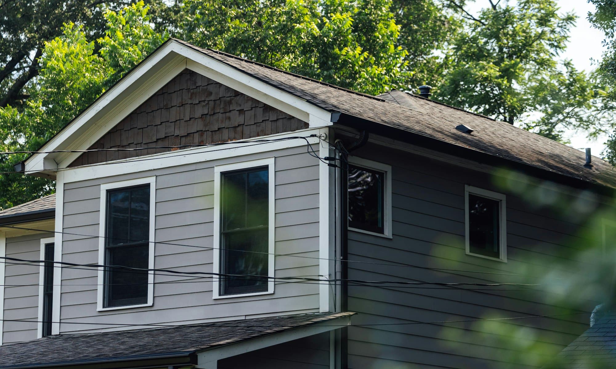 Freshly painted two-tone home exterior with crisp white trim
